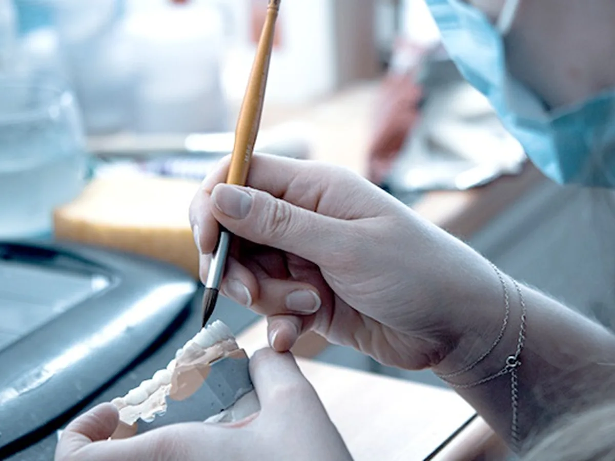 Patient eating and caring for temporary prosthesis teeth after implant surgery